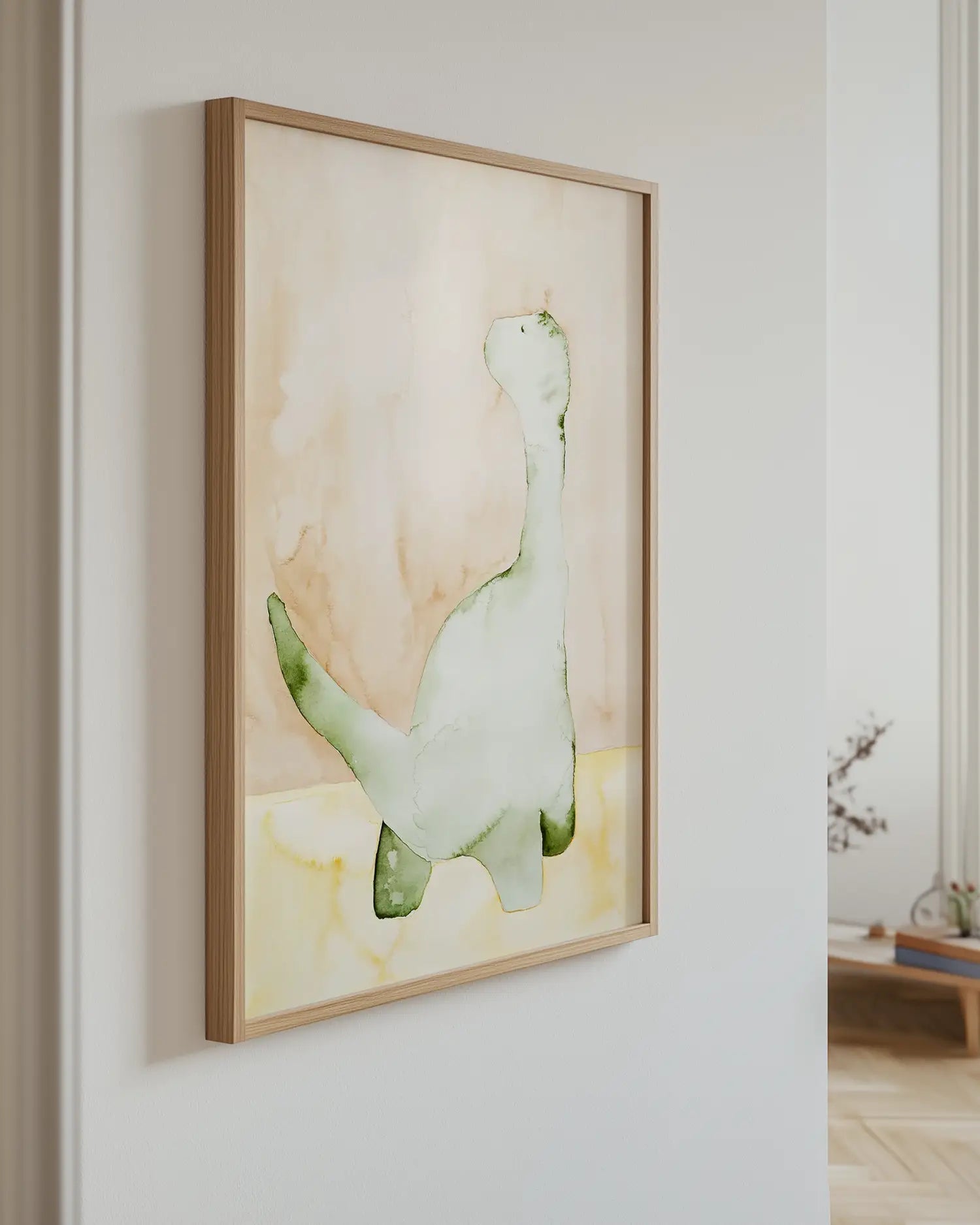 Children's artwork of a dinosaur on a wall in a room with a wooden floor.