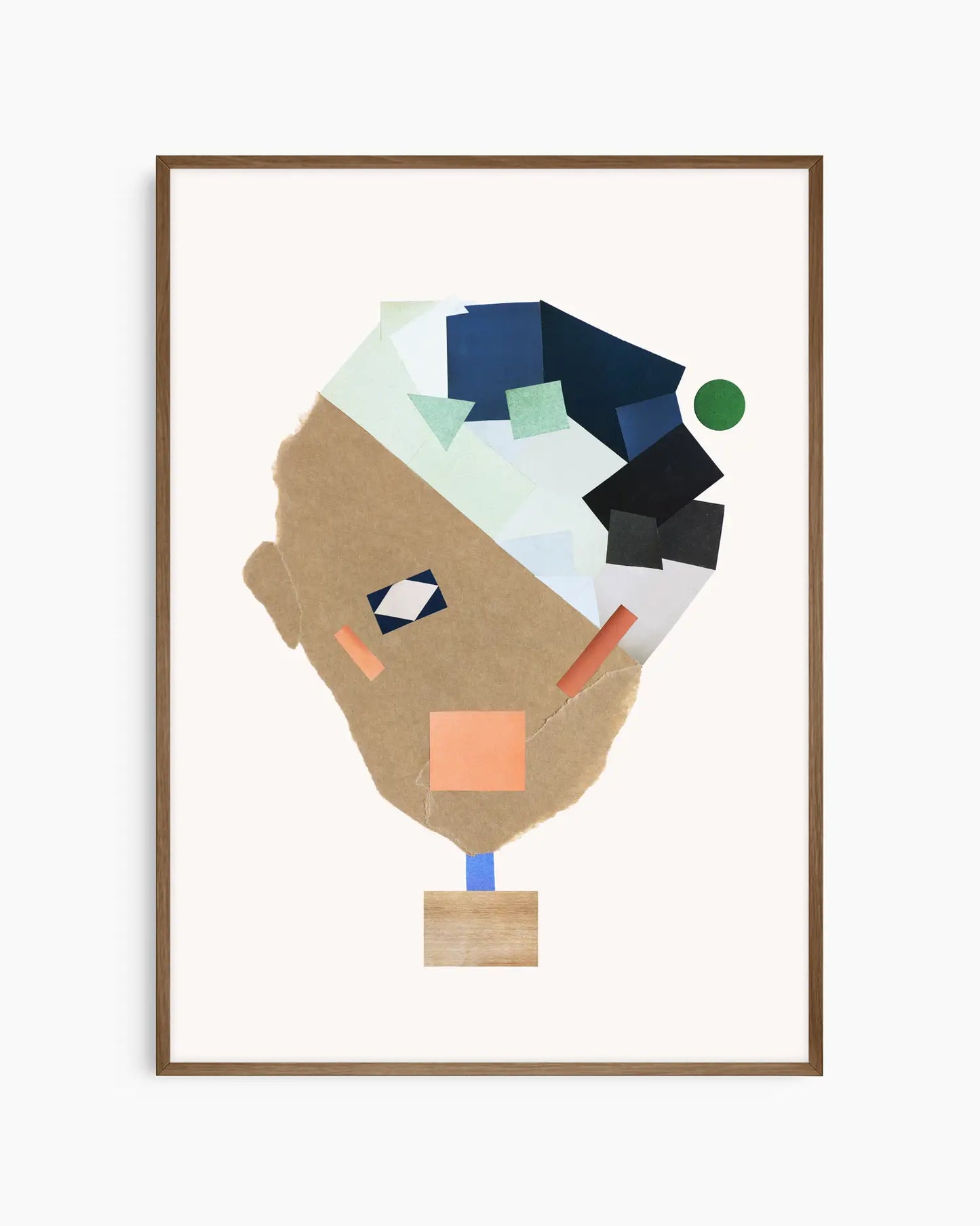 Nursery poster of a collage face made from colorful shapes on a white background framed in a dark oak frame.