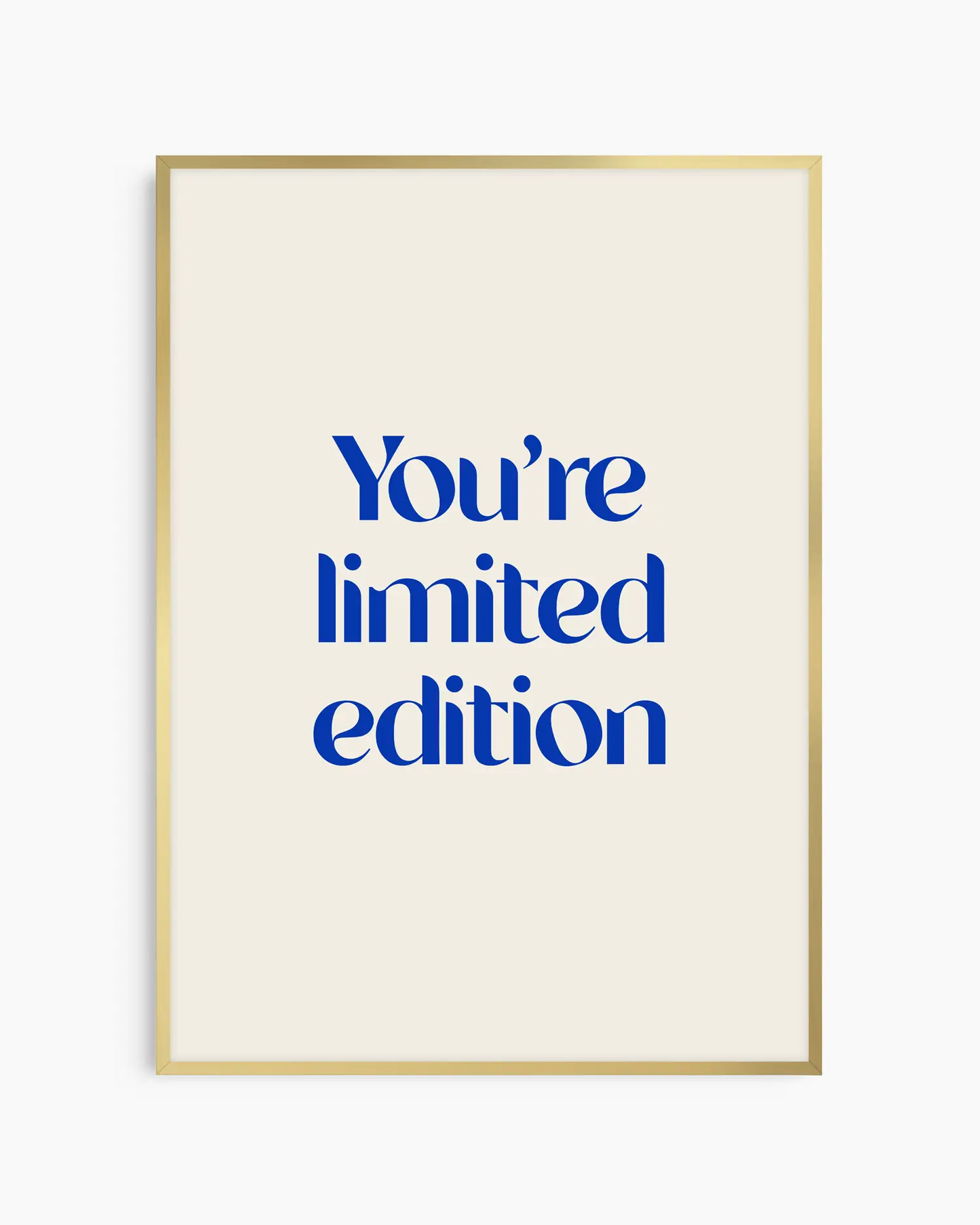 Nursery poster with 'You're limited edition' text in blue framed in a gold frame