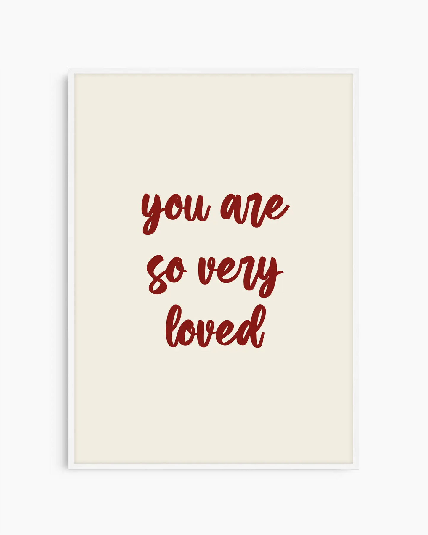 Nursery poster with red 'you are so very loved' text on a beige background. White frame.
