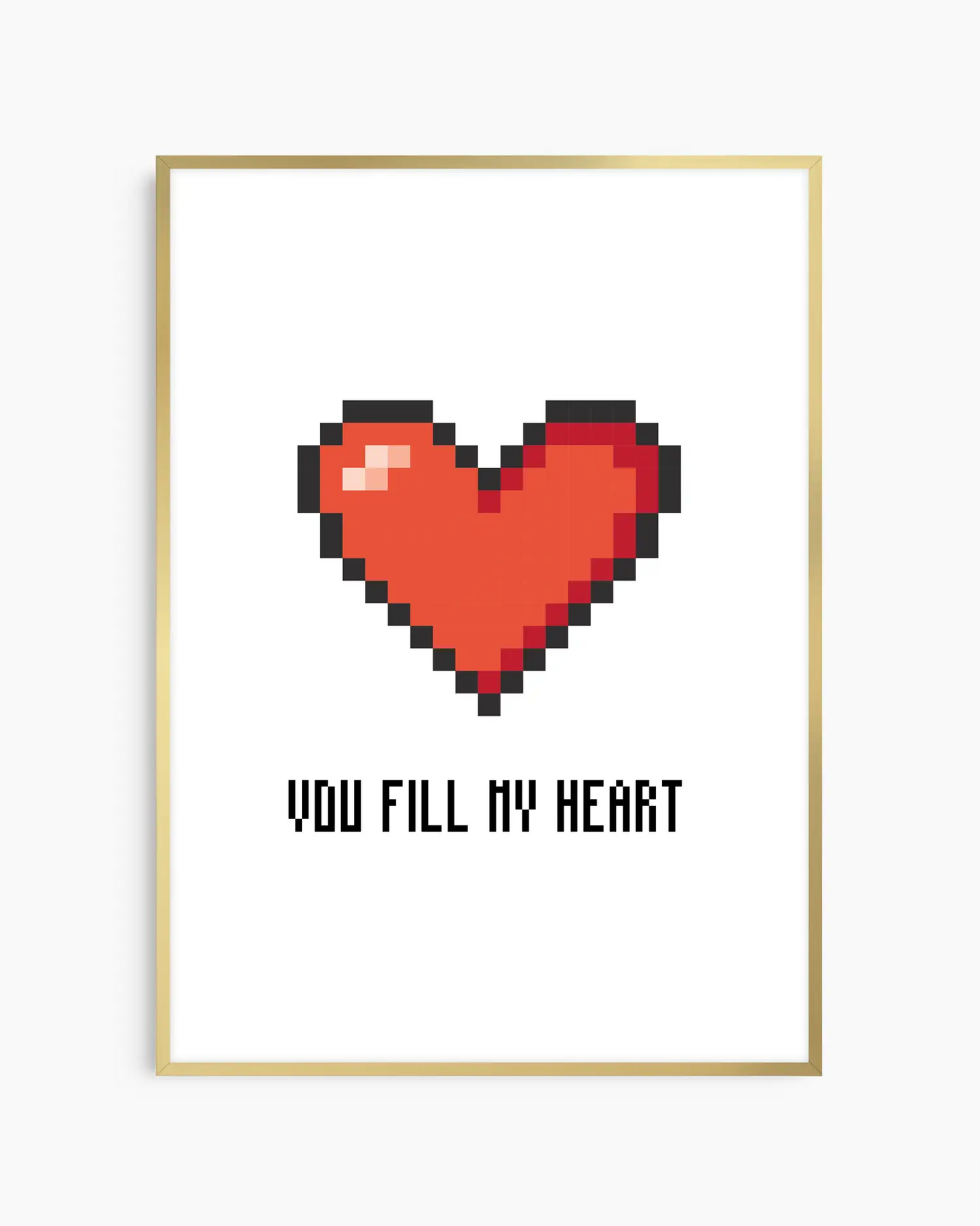 Nursery poster with a red pixel heart and the text 'You Fill My Heart' text on a white background, framed in a golden aluminium frame.