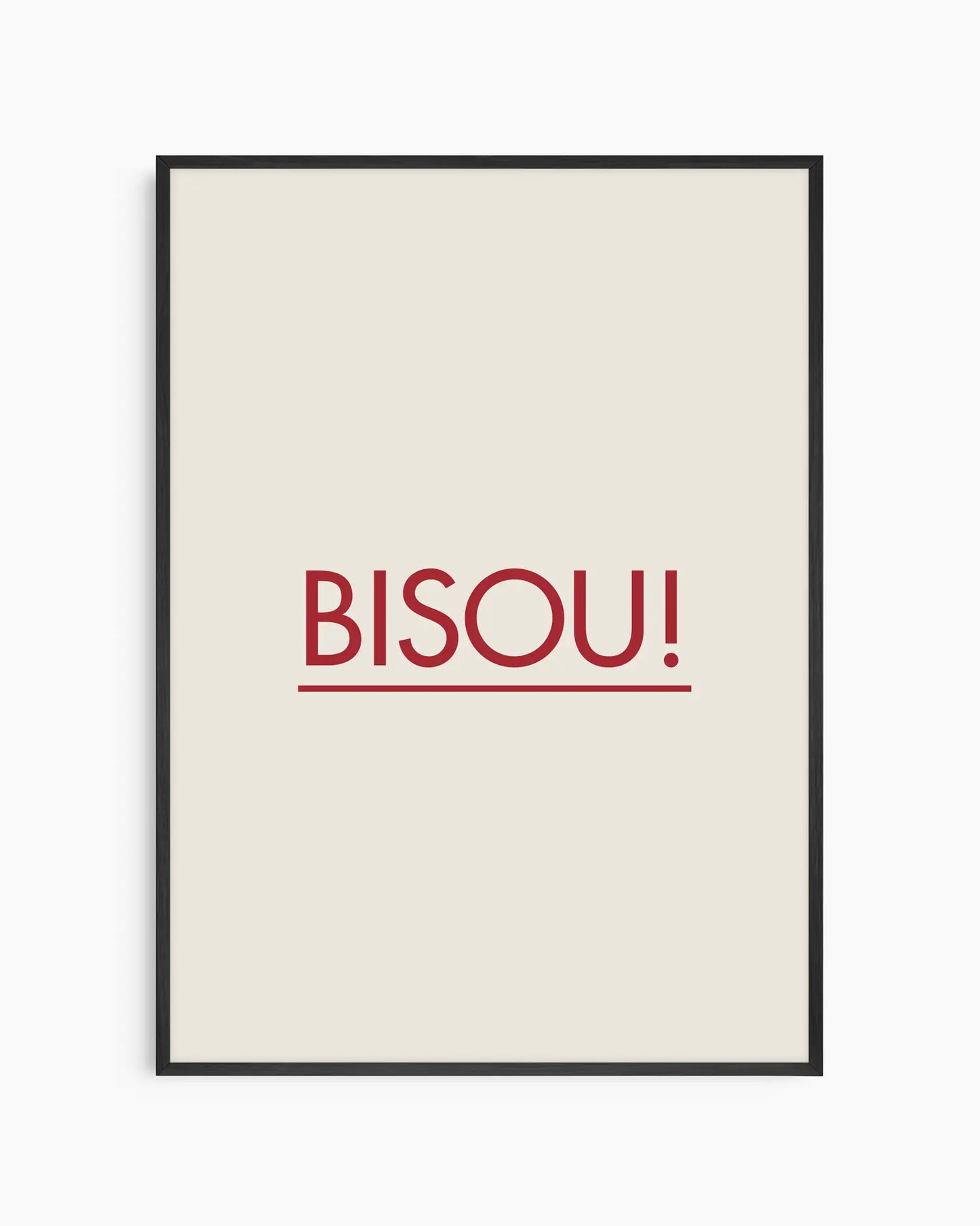 Framed poster with red 'BISOU!' text on a white background, framed in a black wooden frame.