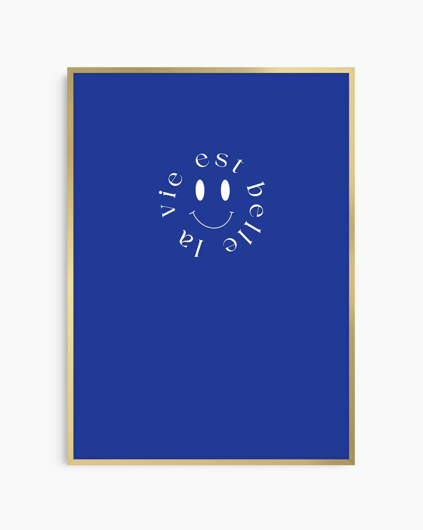 Framed poster with 'La vie est belle' text and smiley face on a blue background