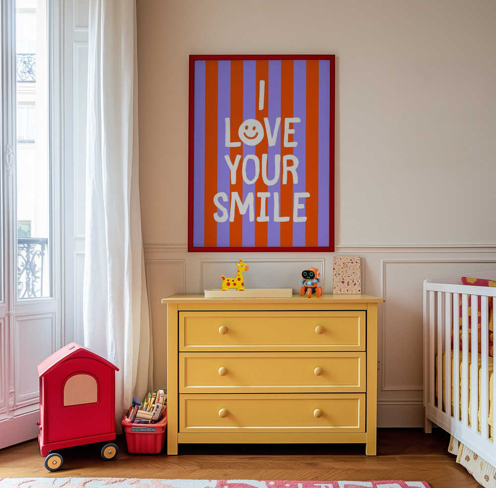 Framed poster with the text 'I love your smile' on a striped background, hanging on the wall in the kids room.