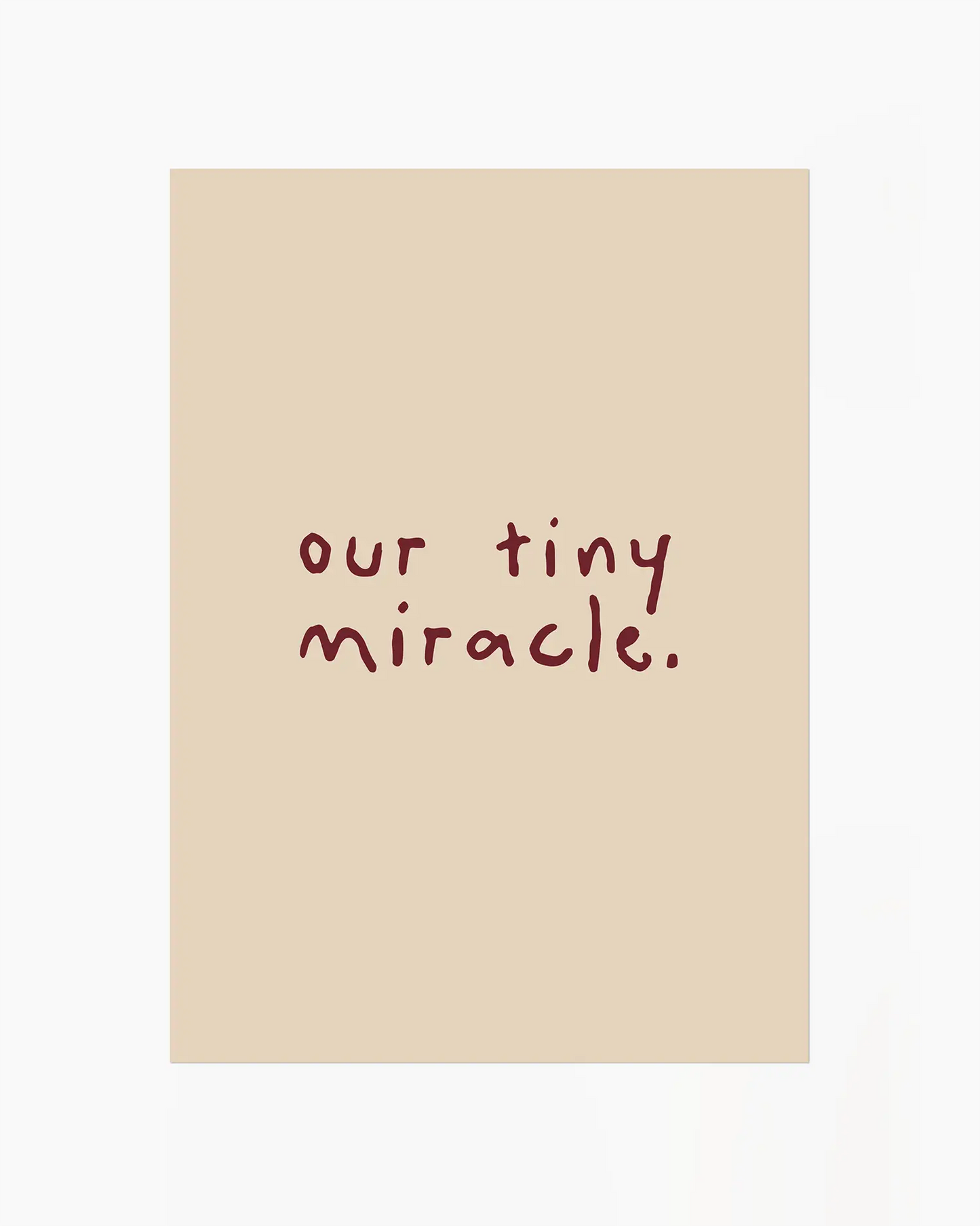 Beige nursery poster with 'our tiny miracle.' text in brown