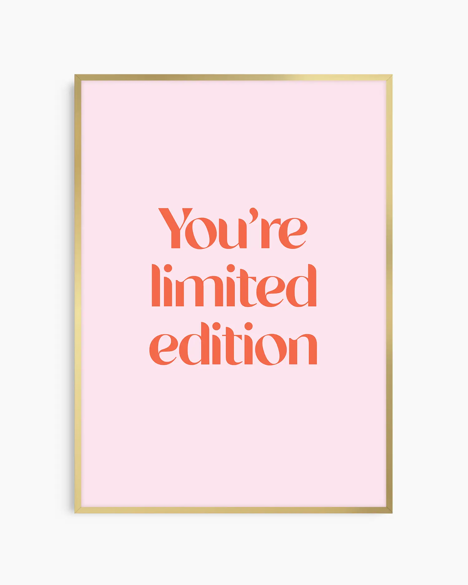 Children's poster with red text 'You're limited edition' on a pink background framed in a gold frame.