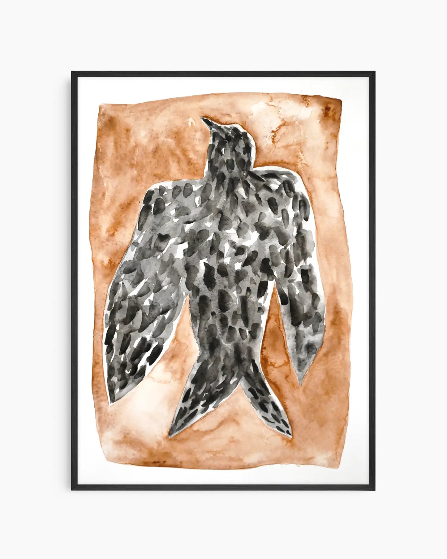 Artwork for the nursery of a black falcon on a brown background framed in a black frame.