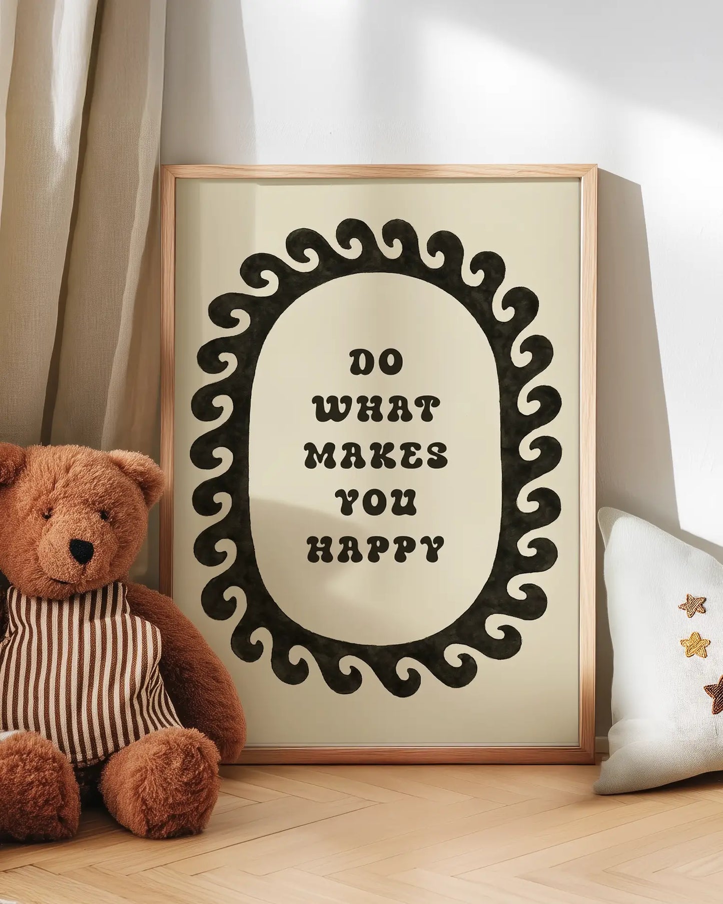 Motivational quote with a teddy bear and decorative pillow on a wooden floor.