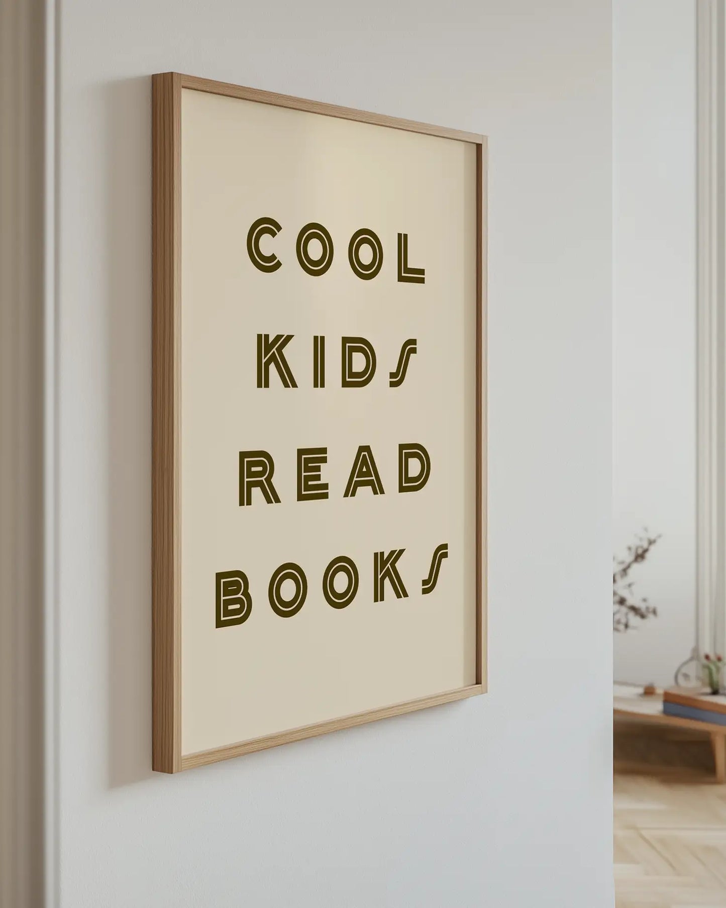 Poster with the text "Cool Kids Read Books" on the wall