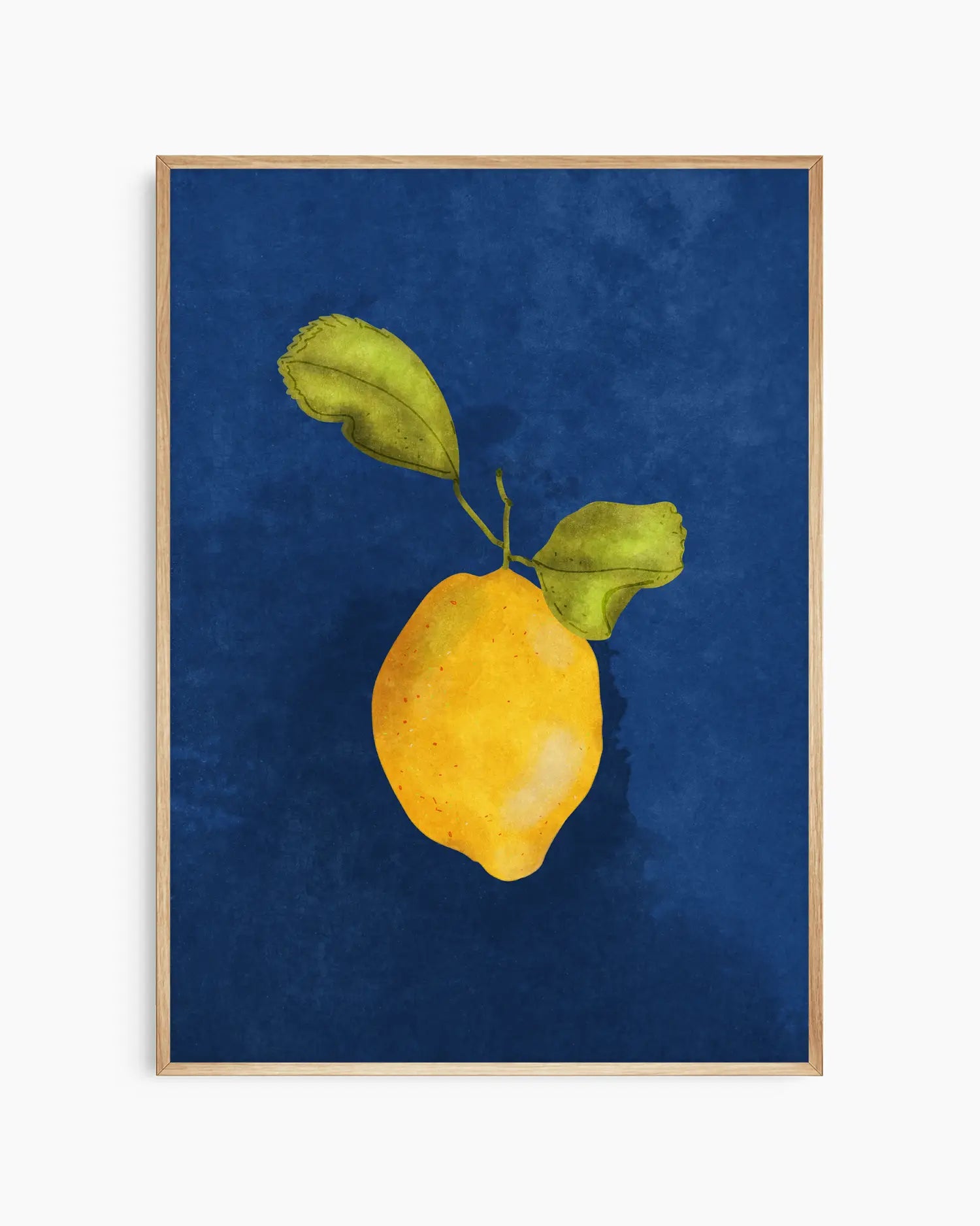 Framed artwork of a yellow lemon with green leaves on a blue background