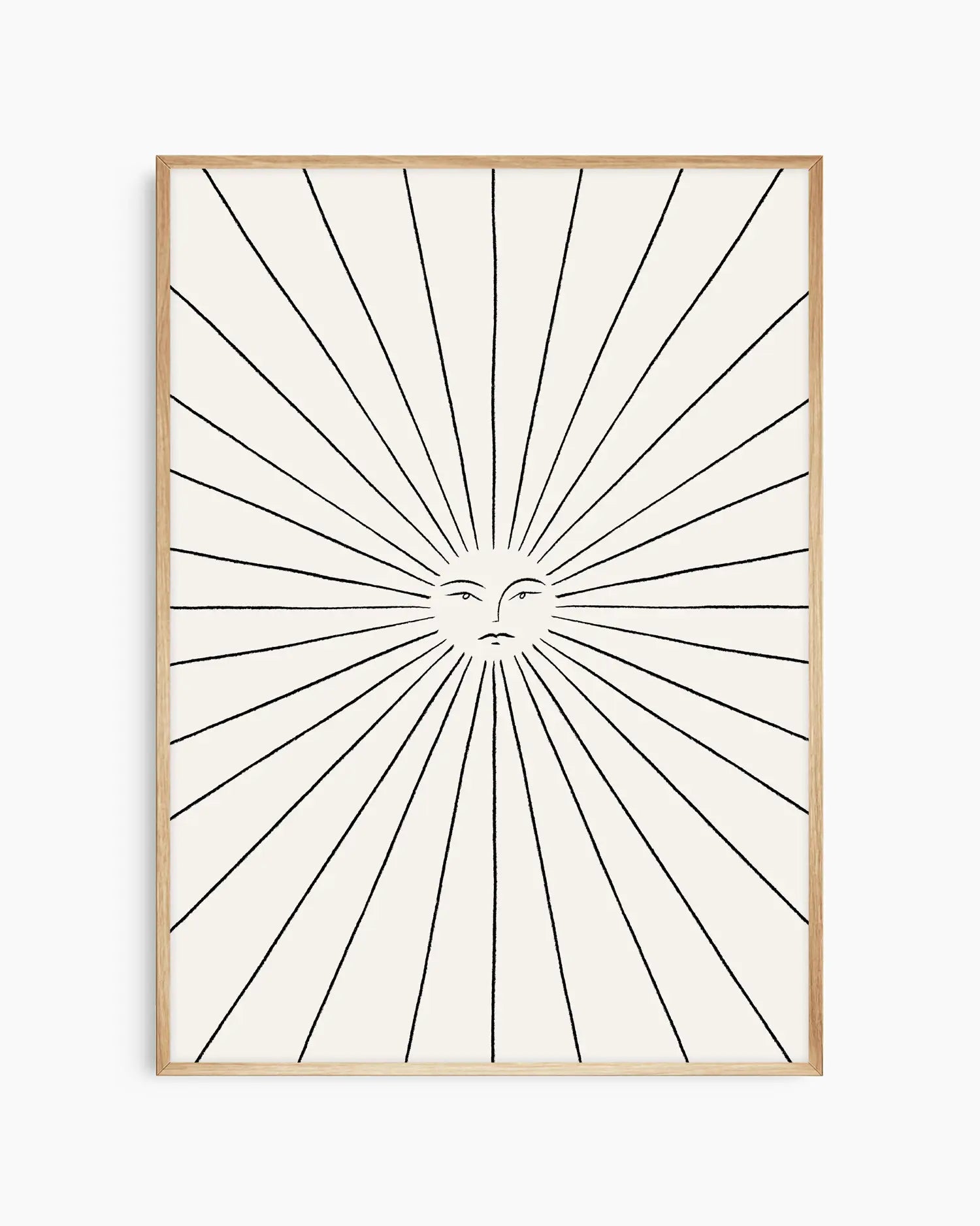 Framed artwork with sunburst design and face in center on white background
