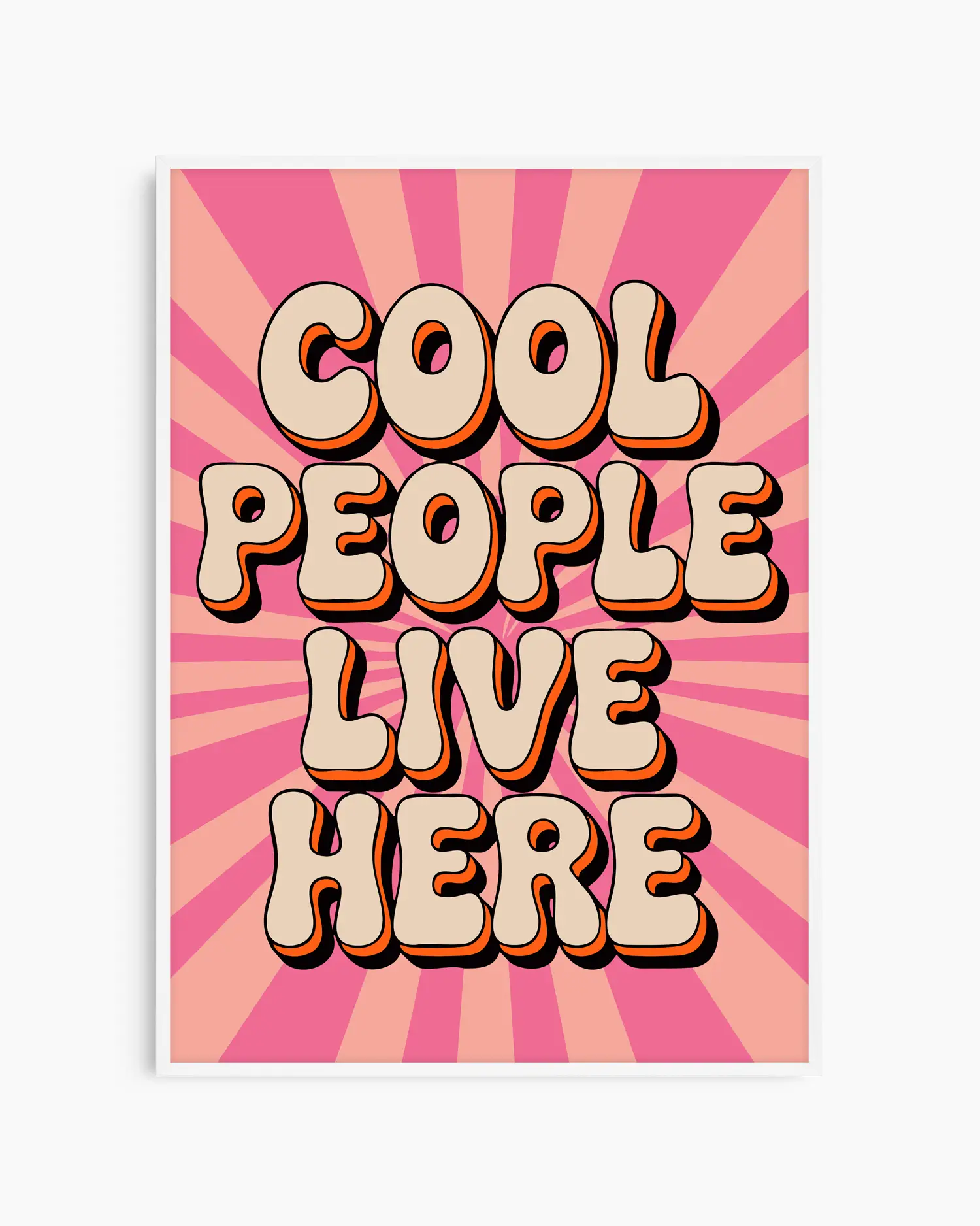 Nursery poster with 'Cool People Live Here' text on a pink sunburst background framed in a white wooden frame.