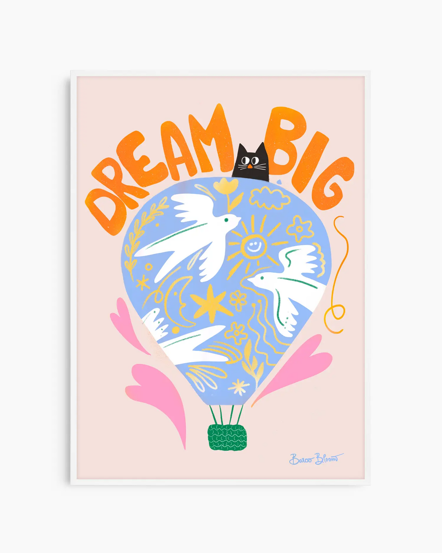 Nursery artwork with a colorful illustration of a hot air balloon, birds, and text "Dream big" on a light pink background. Framed in a white wooden frame.