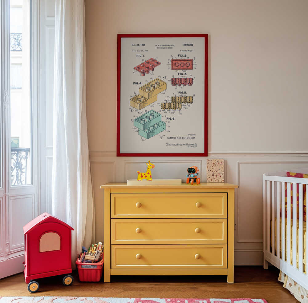 Framed classic toy brick blueprint art hanging above a yellow dresser in a kids room. Colorful patent diagrams of interlocking building blocks, perfect for creative playroom decor, nursery art, and toy-themed children’s spaces.