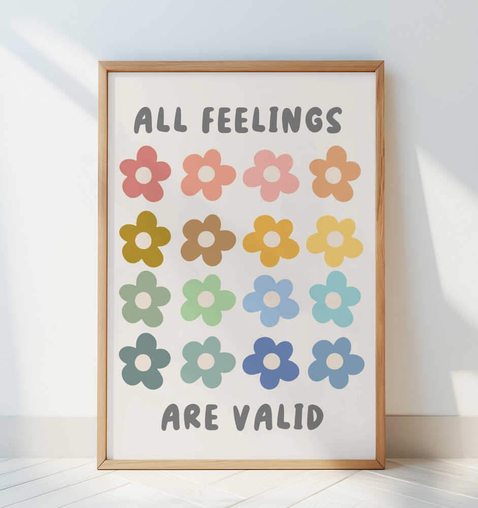 Framed affirmation poster displayed in a bright minimal room. Soft pastel flower motifs and text “All feelings are valid,” ideal for Scandinavian nursery decor, emotional learning spaces, and gentle children’s art.