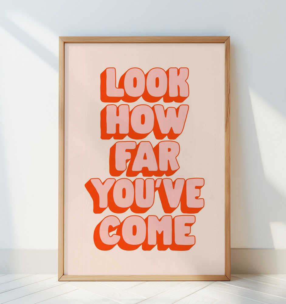 Framed poster with 'Look how far you've come' pink and red text on a light background
