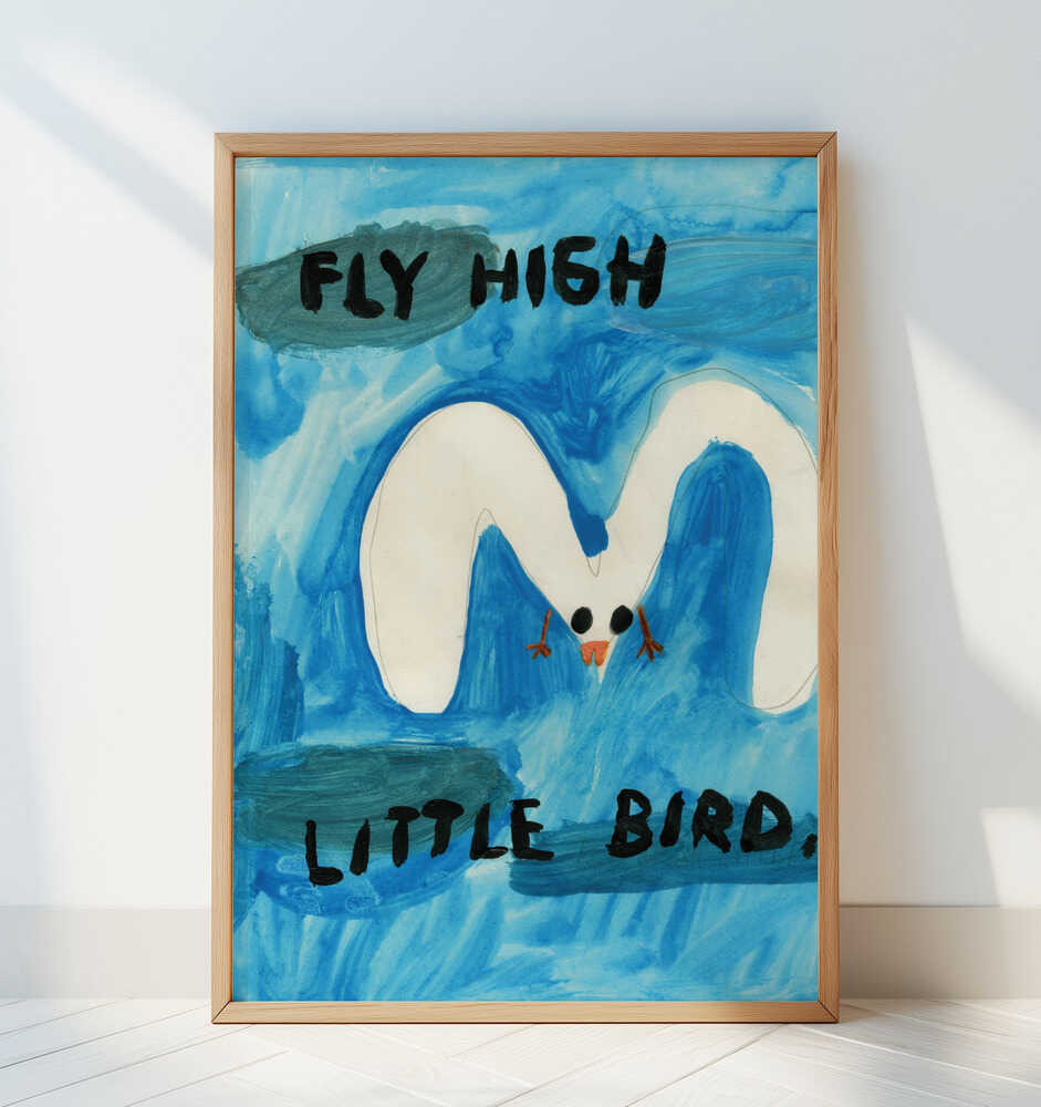 Framed “Fly High Little Bird” art print with soft blue sky tones and uplifting message, perfect for a bright and cheerful nursery.