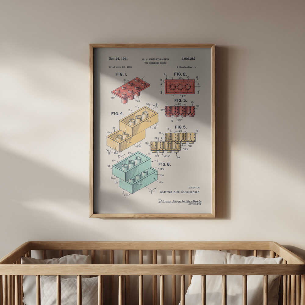 Framed building-brick patent print hanging above a wooden crib. Retro technical drawings of stackable toy bricks in soft tones, adding a nostalgic and educational touch to a modern nursery environment.