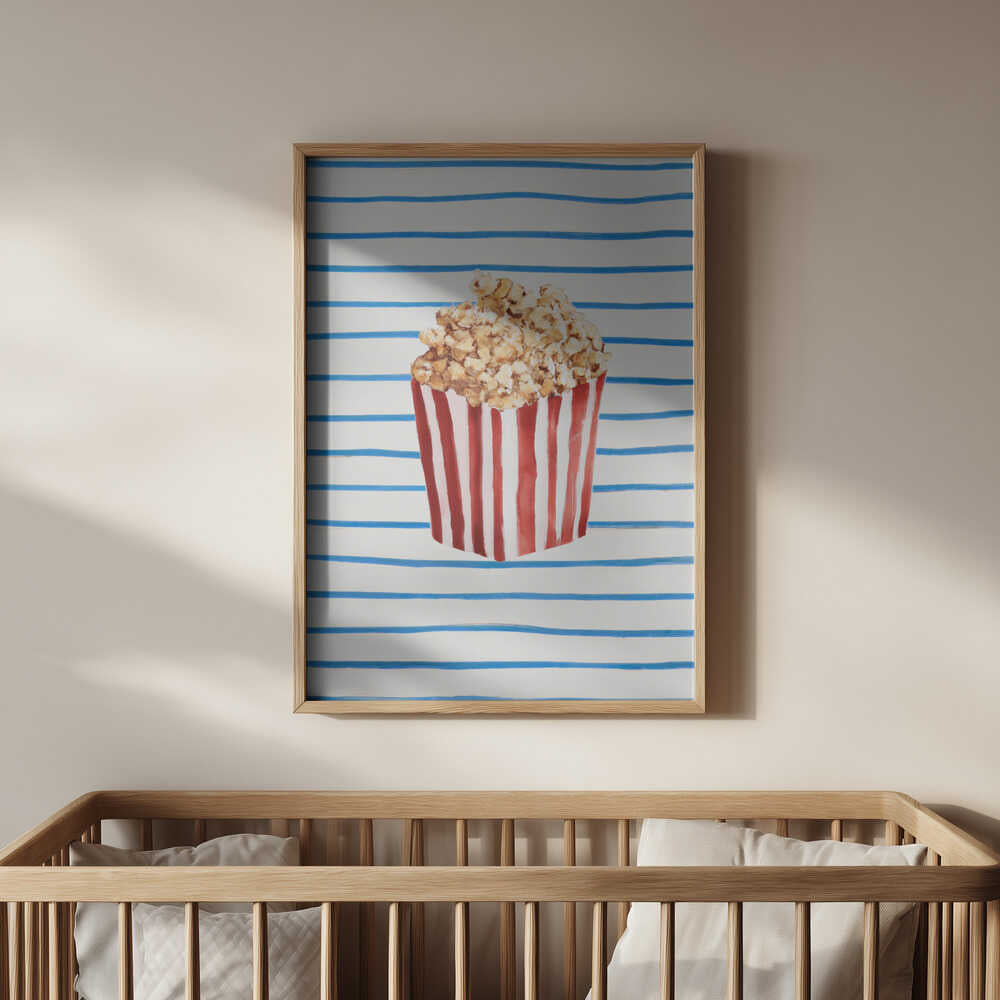 Fun and artistic popcorn wall print framed in light wood and hanging above a baby’s crib. The soft tones and playful design make it a charming and unique addition to a colorful nursery or family playroom.