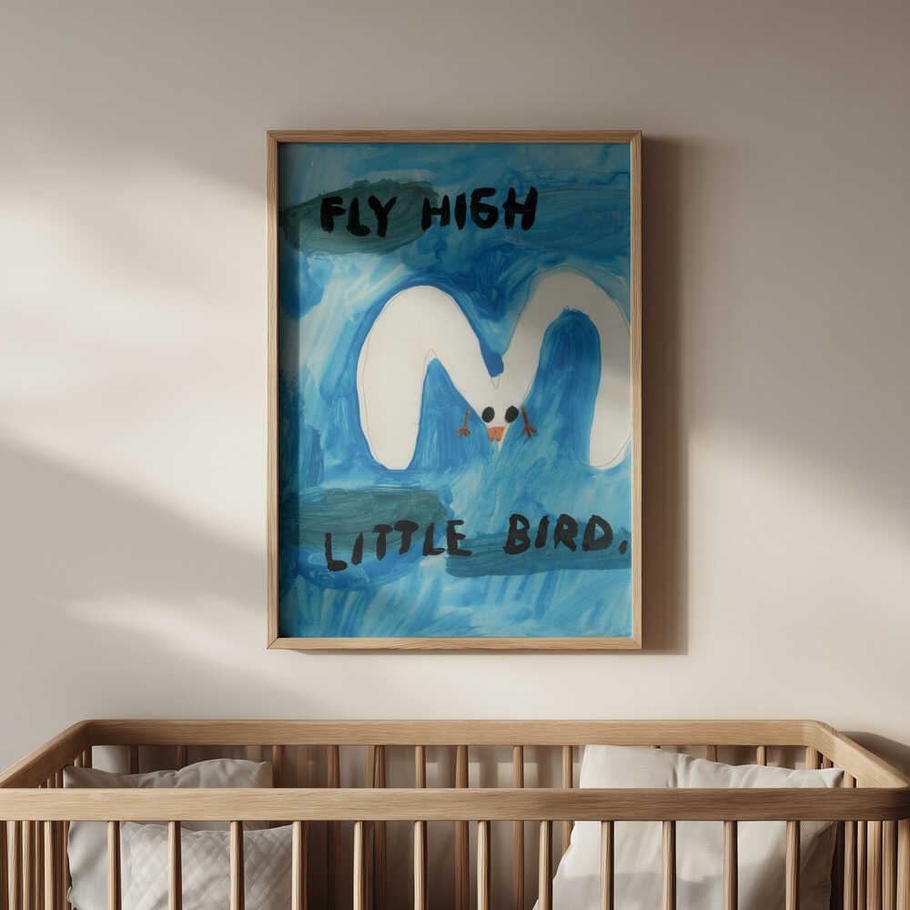 Framed “Fly High Little Bird” poster above a natural wood crib, soothing blue nursery wall art for a modern baby room.